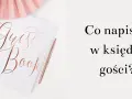 Elegancka księga gości z napisem "Guest Book" i długopisem. Pytanie "Co napisać w księdze gości?" zachęca do kreatywności.