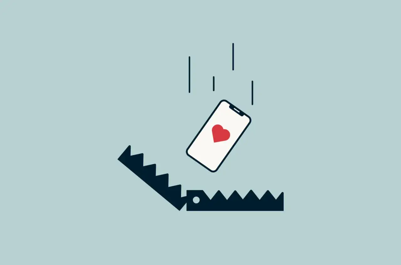 Telefon z sercem spada w pułapkę. Ilustracja symbolizuje rzeczy, o których kłamiemy na portalach randkowych, by zdobyć czyjeś serce.